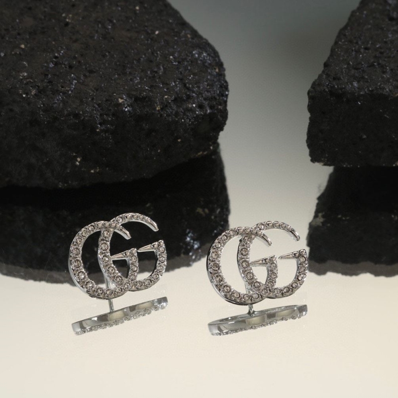 G*u*i earrings